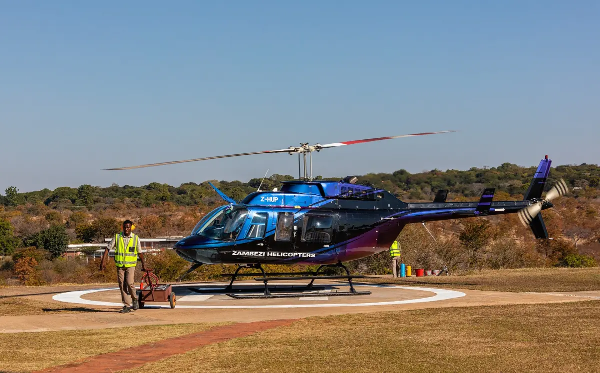 A tour helicopter on a helipad near Victoria Falls