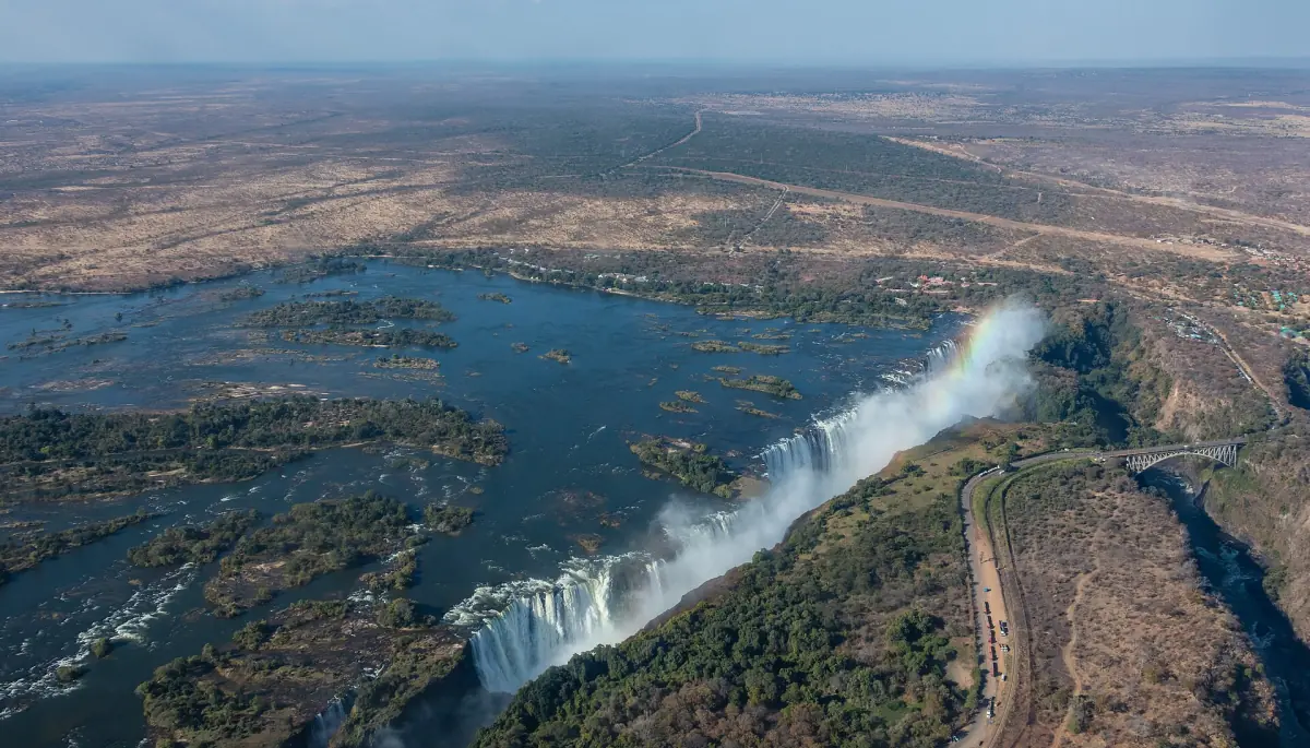 A wide aerial view of Victoria Falls and the Zambezi